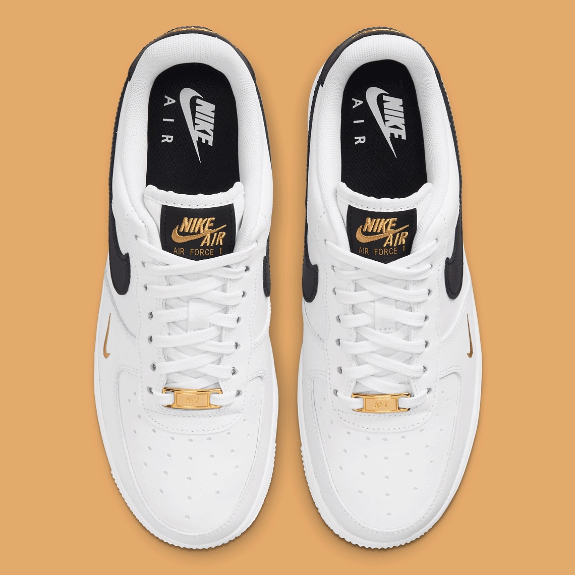 gold and black air force ones