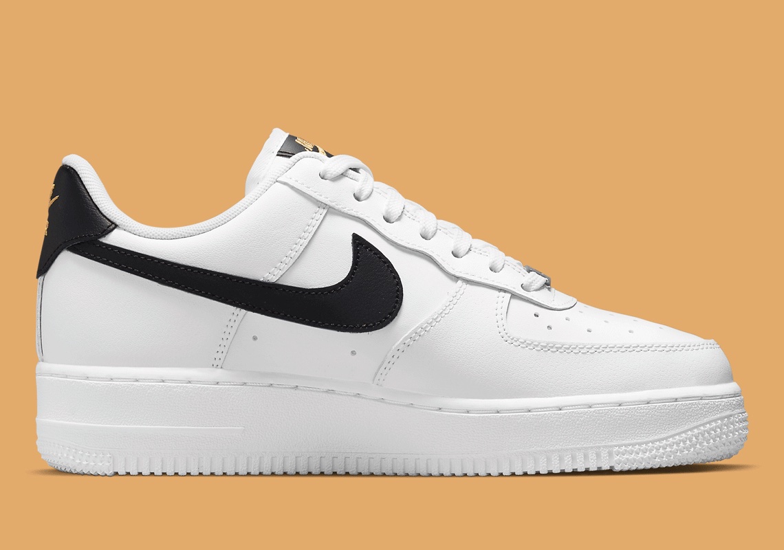 white nike air force with black swoosh