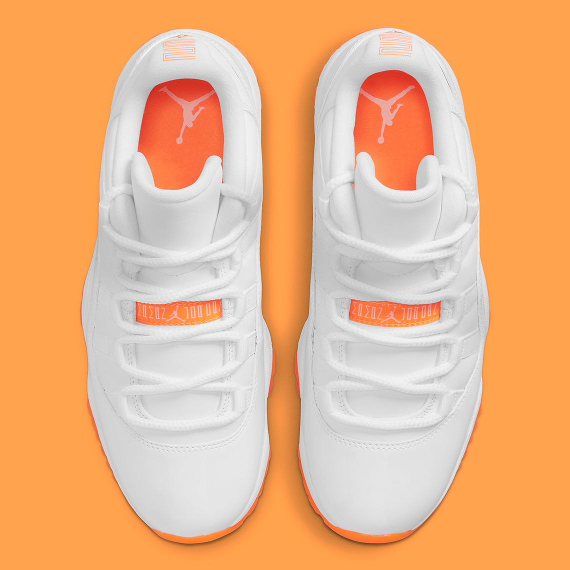 white and orange jordan 11