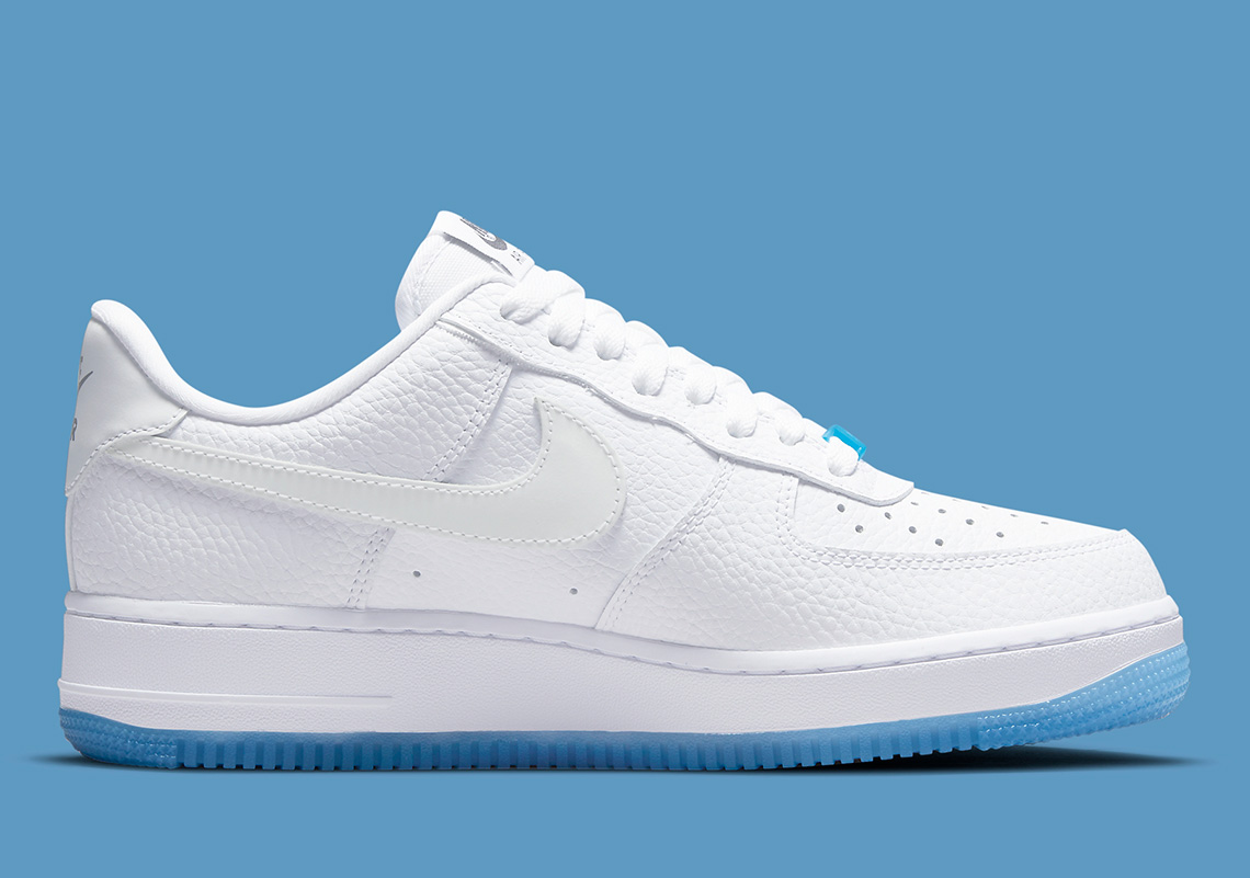 white air force ones with blue bottom