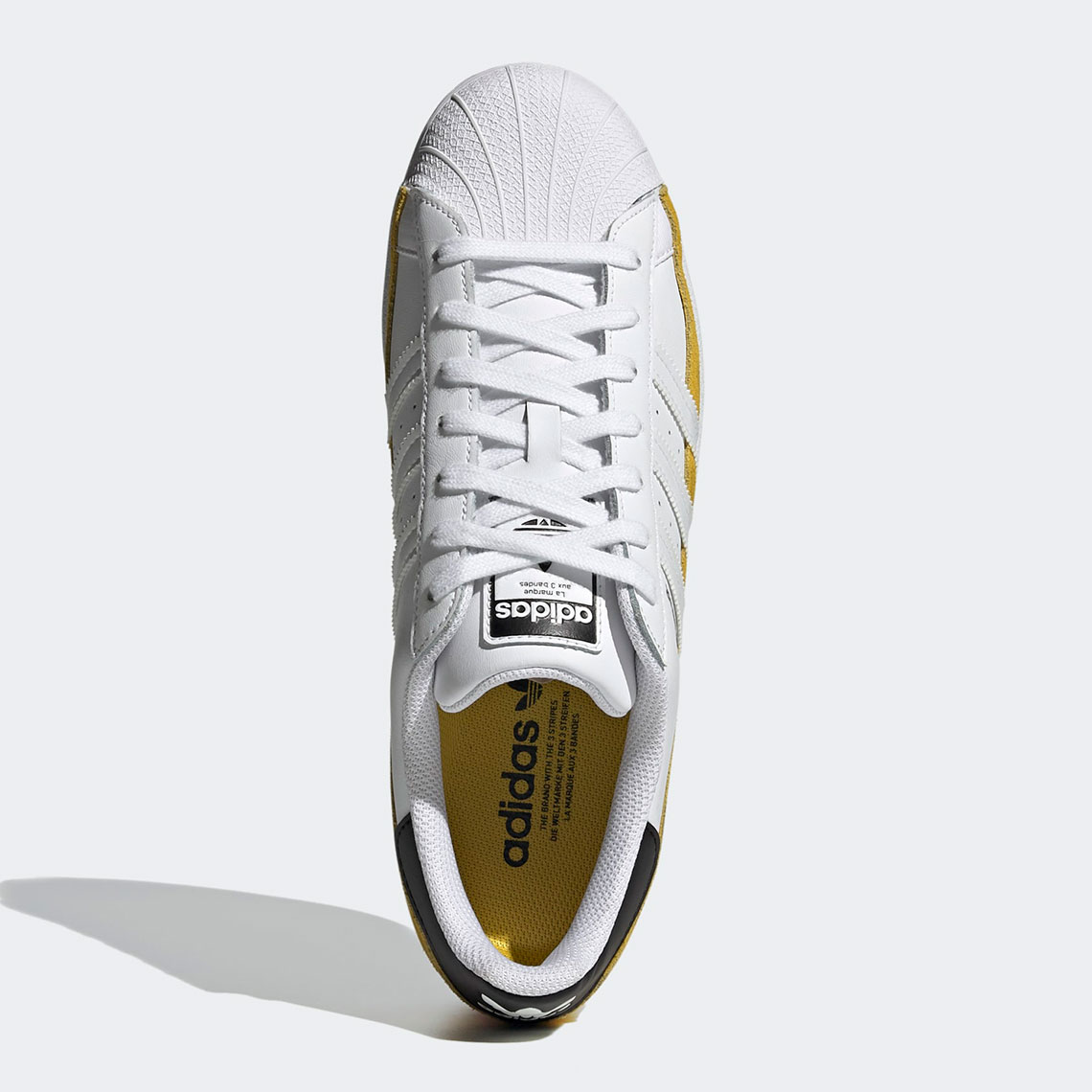 adidas Superstar Hazy Yellow Cloud White FX5570 | SneakerNews.com