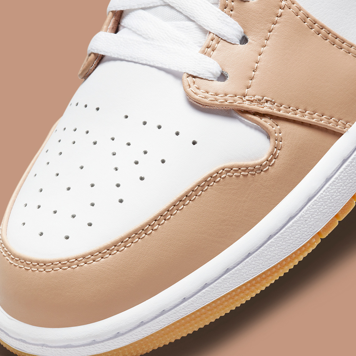tan linens cover this air jordan 1 mid