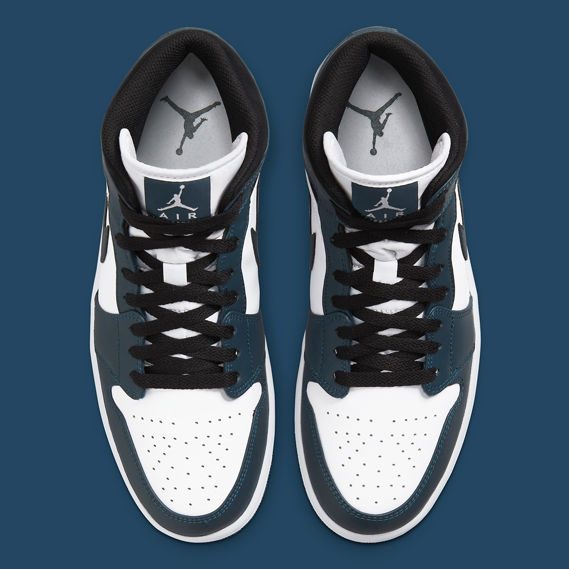 black and white jordan 1 with blue swoosh