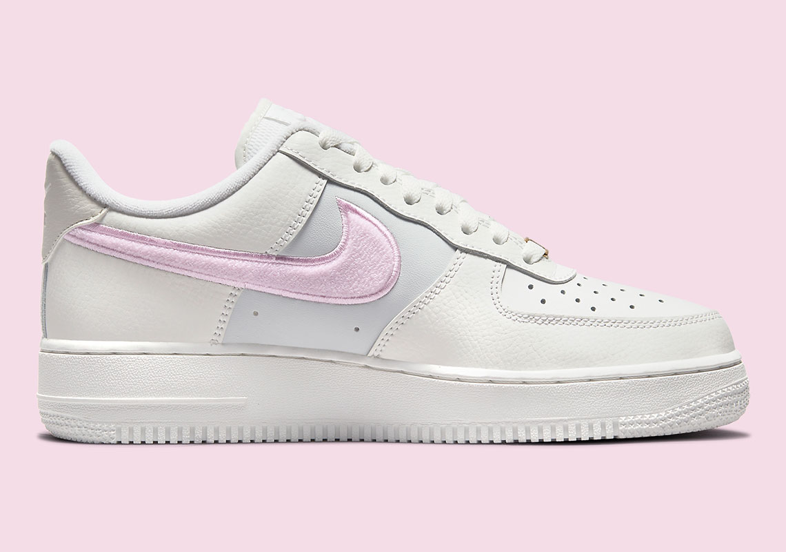white nike air force with pink swoosh
