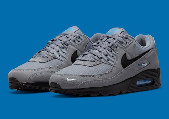 A Hint Of Blue Splashes Onto A Grey Nike Air Max 90