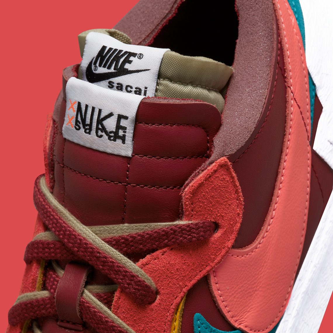 KAWS sacai Nike Blazer Low Team Red DM7901 600 SneakerNews