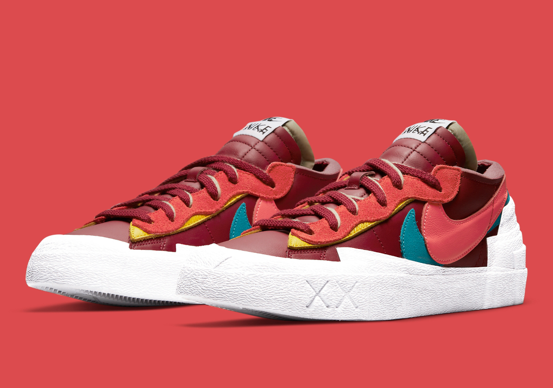 KAWS sacai Nike Blazer Low Team Red DM7901-600 | SneakerNews.com