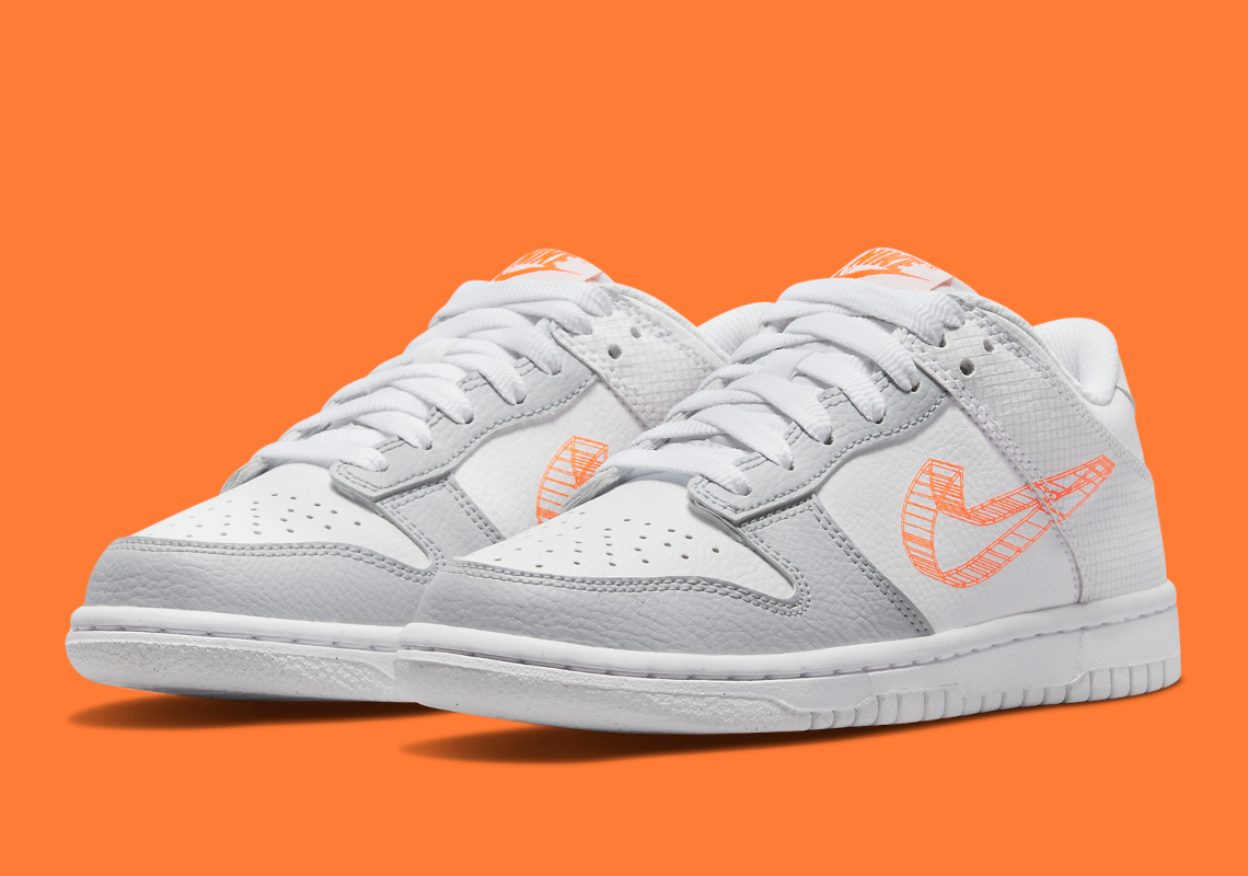 Another Kid's Nike Dunk Low Gets Experimental With Orange 3D Swooshes