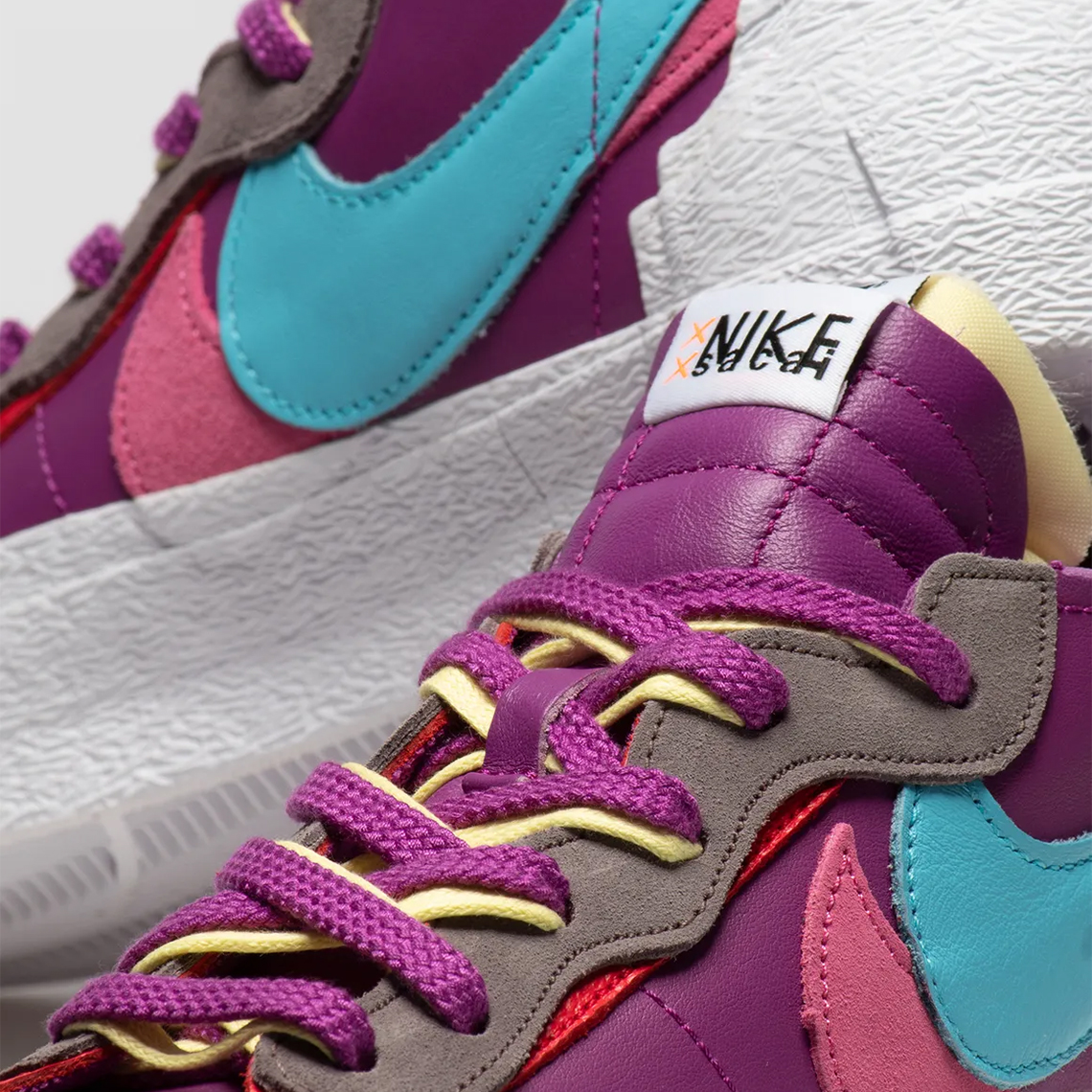 KAWS sacai Nike Blazer Low "Purple Dusk" DM7901-500 | SneakerNews.com