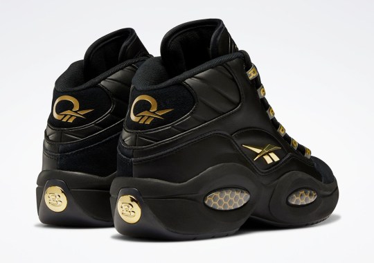The Reebok Question Mid Shines In Black And Metallic Gold