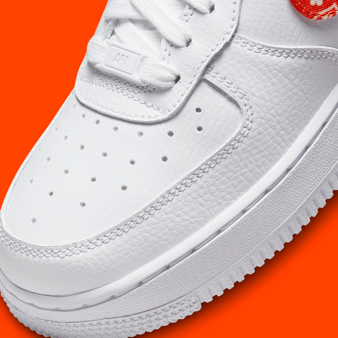 Nike Air Force 1 '07 ESS sneakers in white and orange