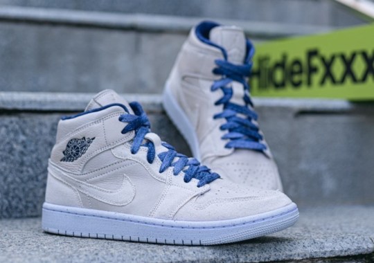 “Coconut Milk”-Colored Canvas Comes Together With Indigo Accents On This Air Jordan 1 Mid