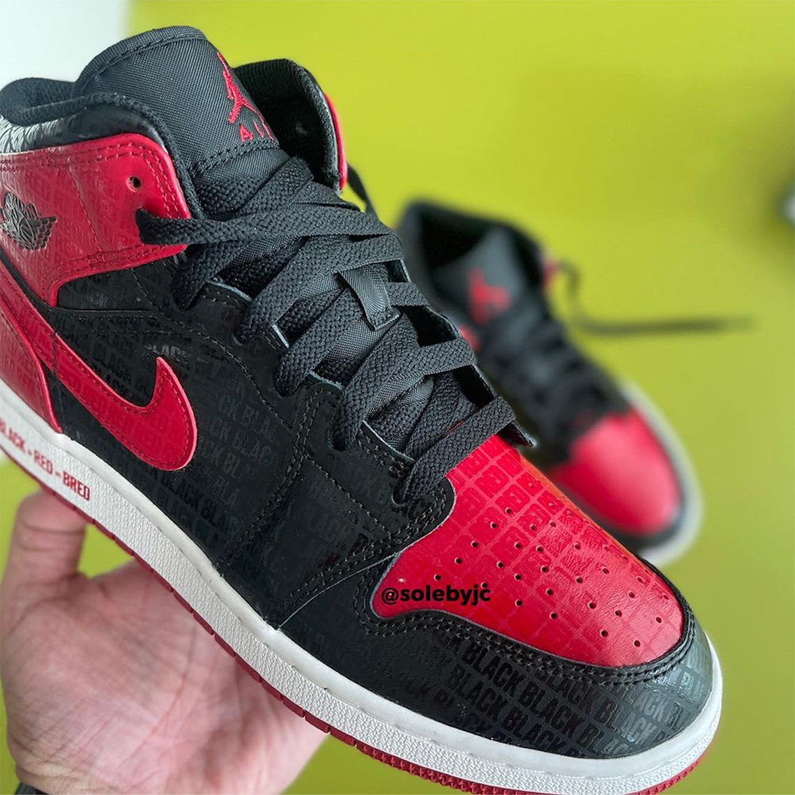 black and red jordan bred