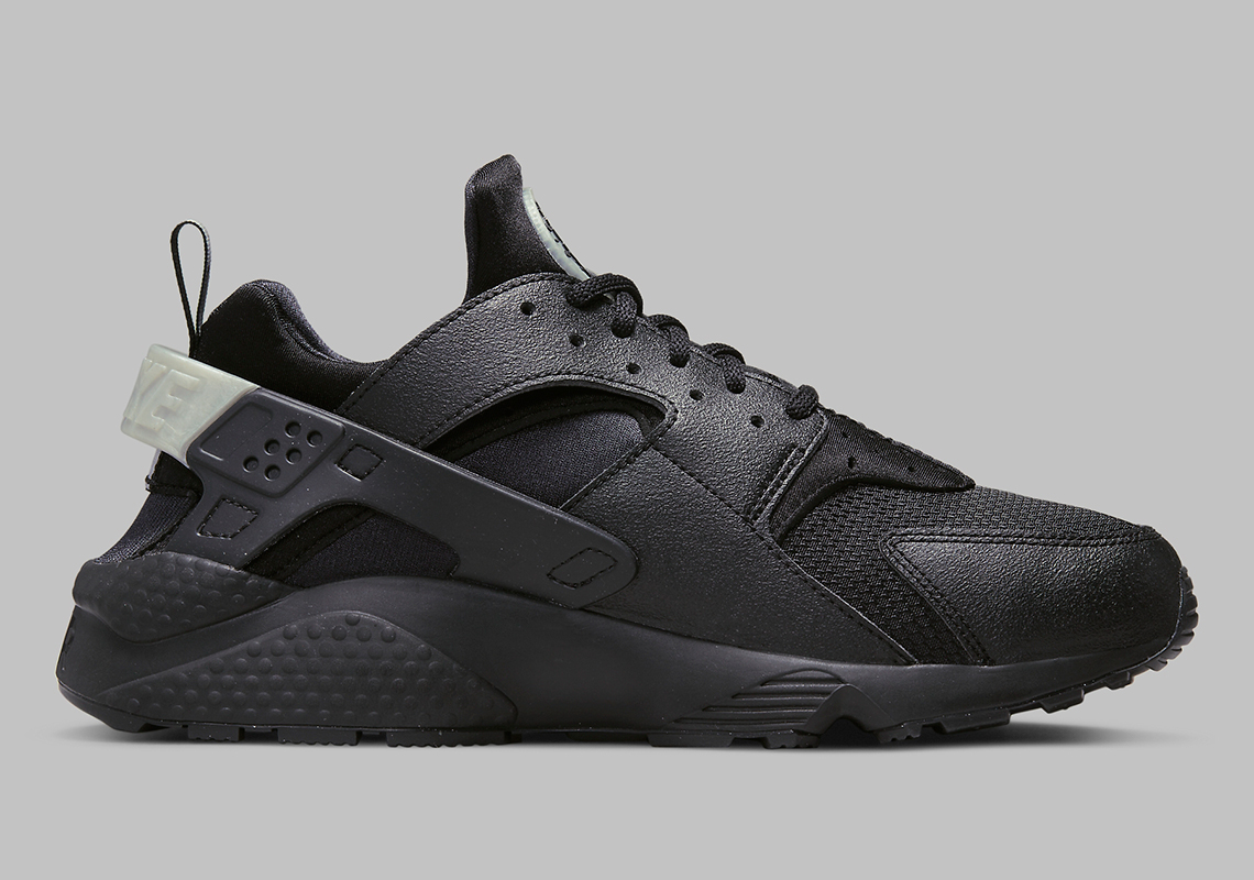 black huaraches with white logo