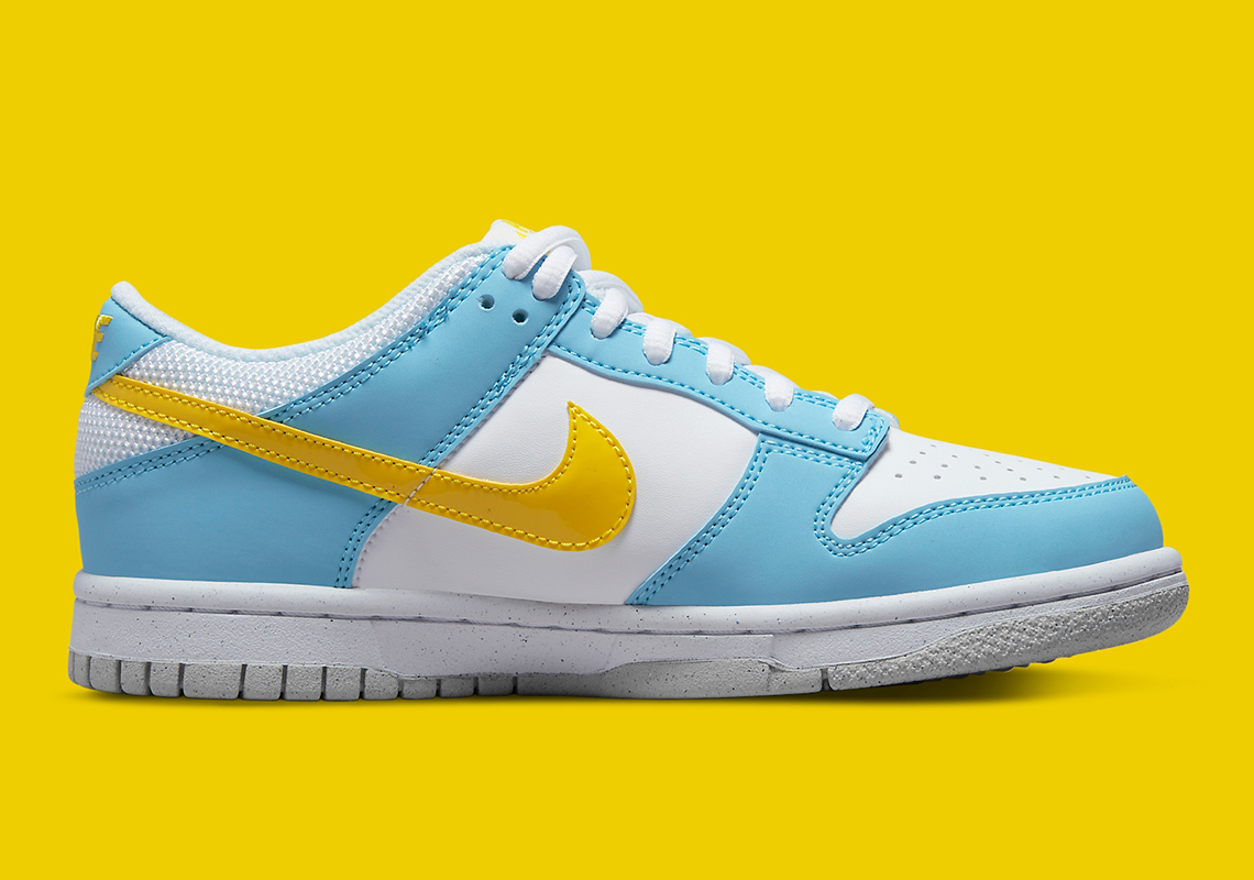 blue and white dunks with yellow