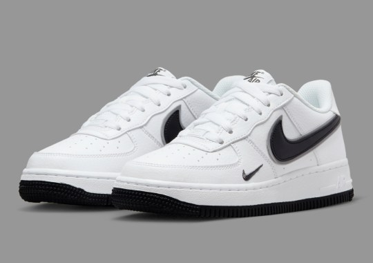 The Kid’s Nike Air Force 1 Low Appears In A Clean “White/Black” Look With Layered Swooshes
