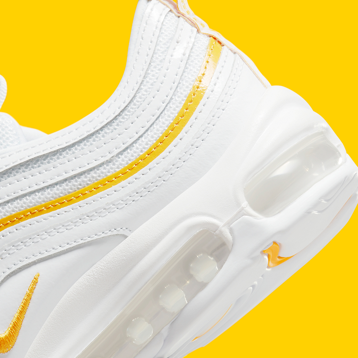 white yellow and black air max 97