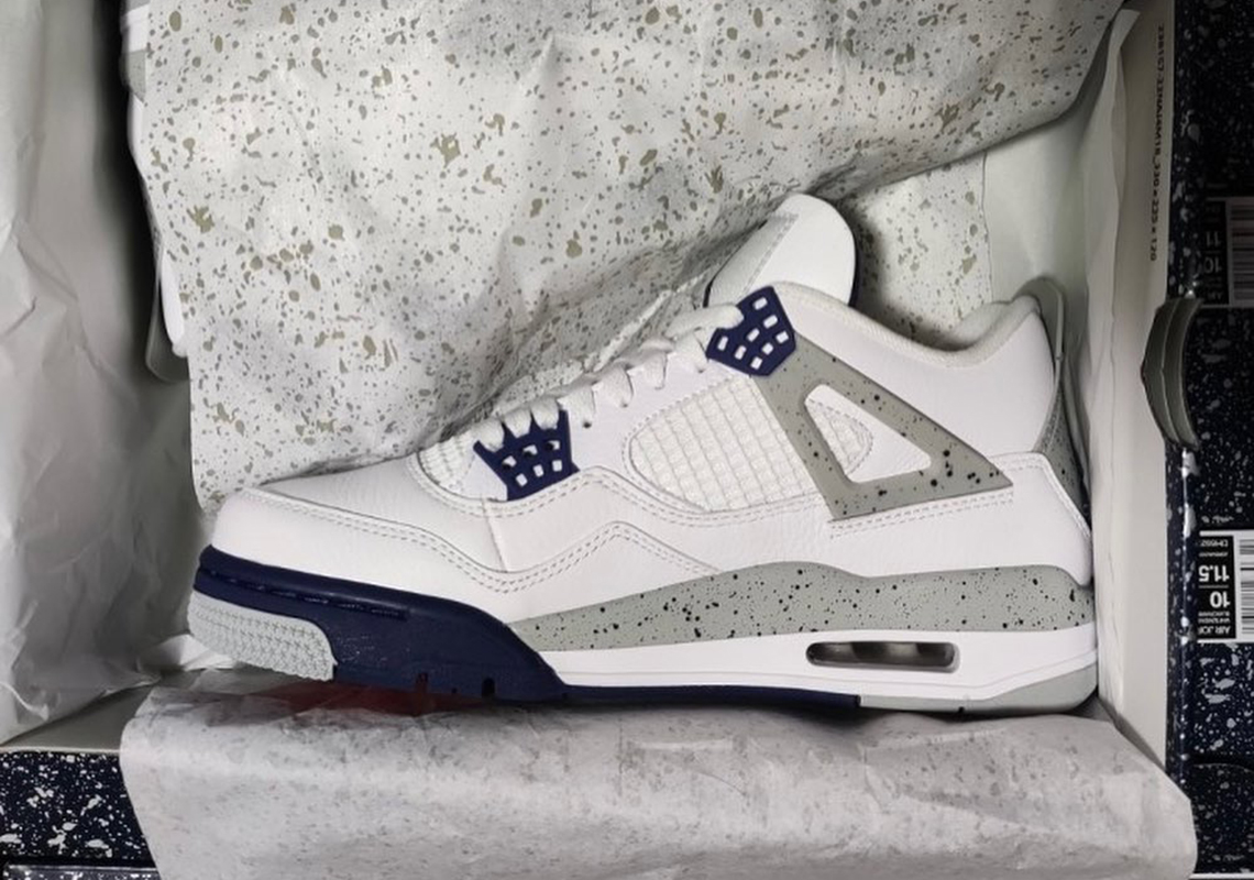 white and navy jordan 4