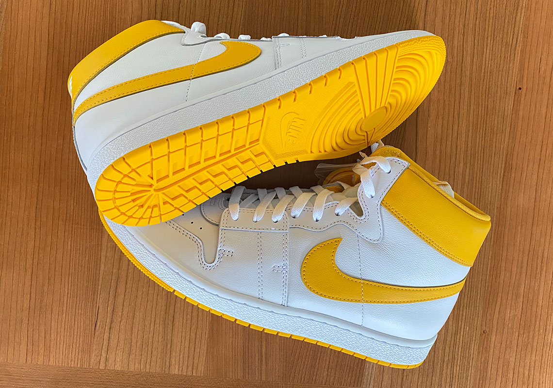 white and yellow nikes