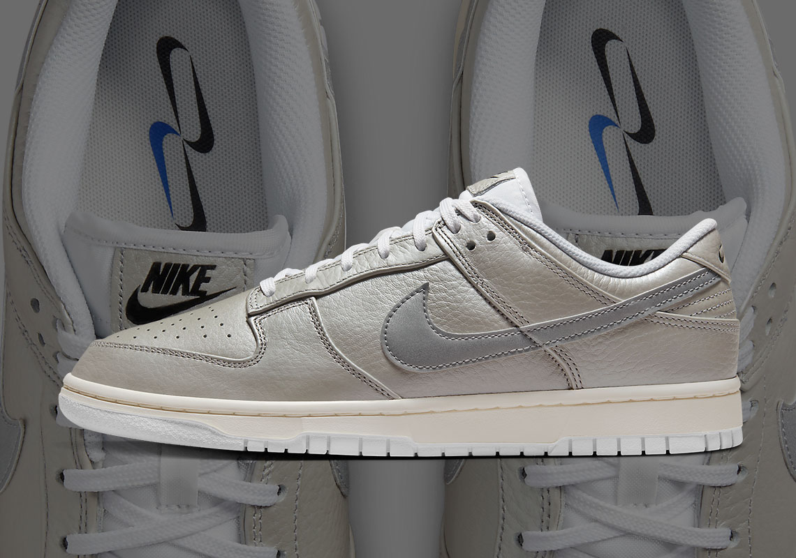 Multiple Swooshes Decorate The Nike Dunk Low "Metallic Silver"