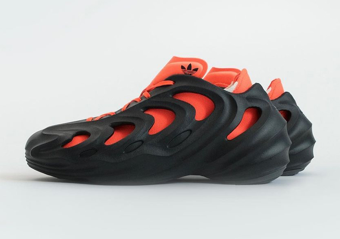 adidas Originals Top Ten low sneakers in orange and black