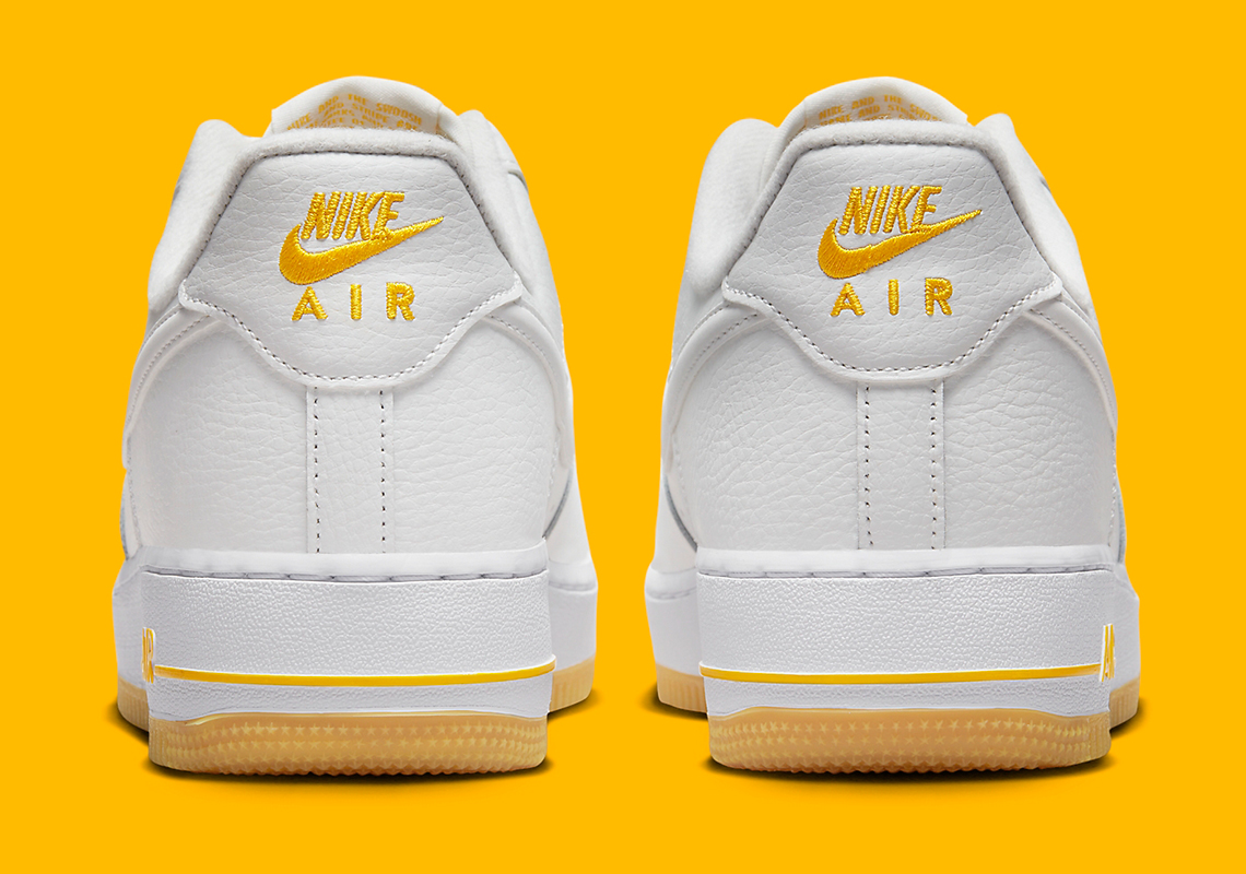 white and yellow air force 1 low
