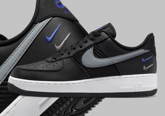 Triple Swooshes Play An Accenting Role To This Black-Dominant Air Force 1 Low