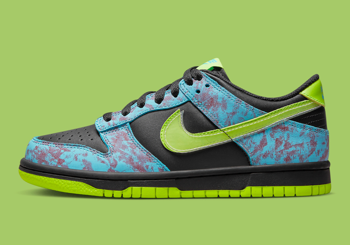 This Kid's Nike Dunk Low Features Acid Wash And "Volt" Accents