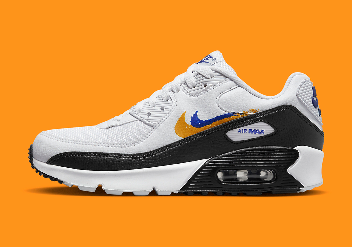 Orange And Blue Swooshes Come Playfully Painted On The Nike Air Max 90