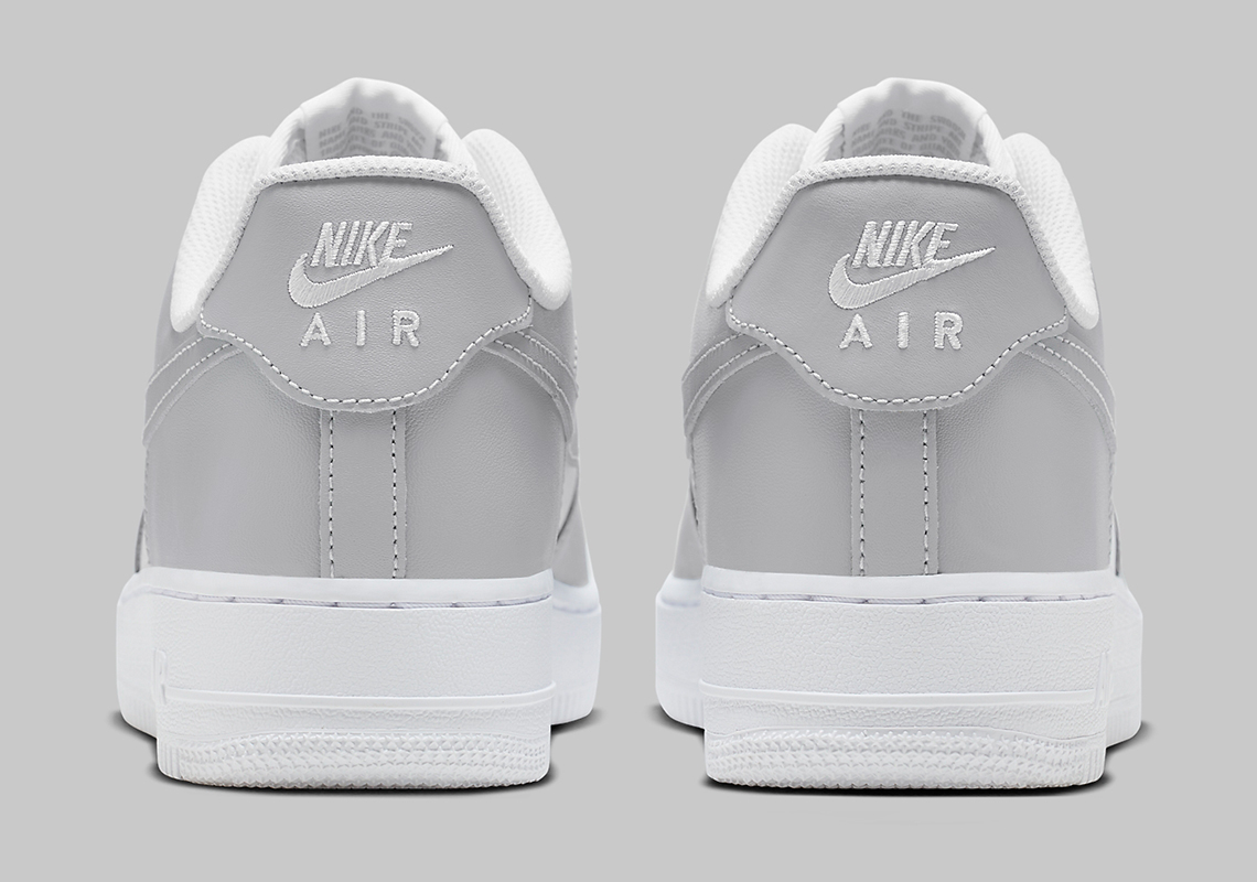 Nike Nike Grå träningsoverall med heltäckande logotyptryck White Grey Fd9763 101 1