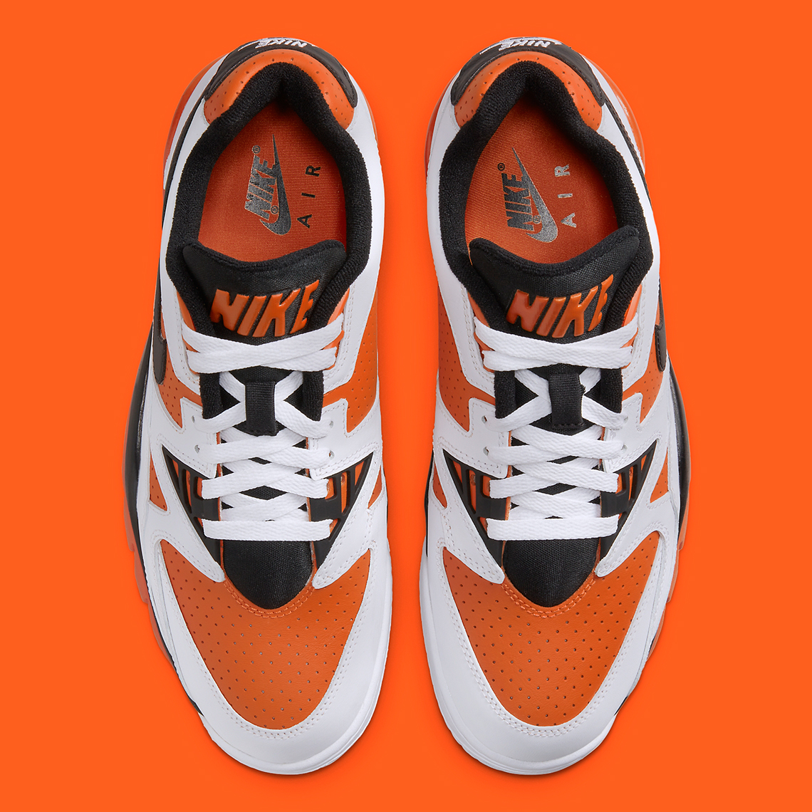 Nike Air Cross Low Sneakers in White & Orange