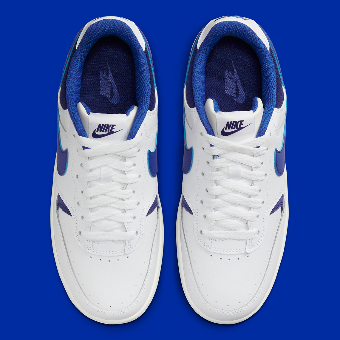 Nike Gamma Force trainers in white and game royal blue