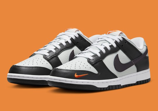 Nike Brightens Up This Black And Grey Dunk Low With Miniature Orange Swooshes