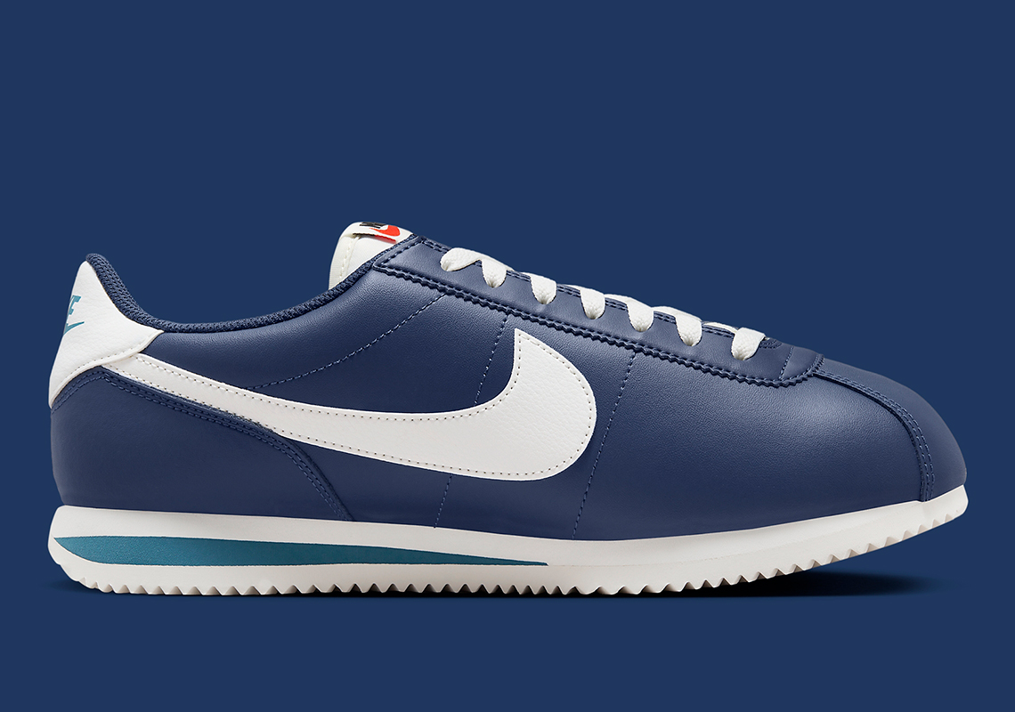 Navy blue and store white nike cortez