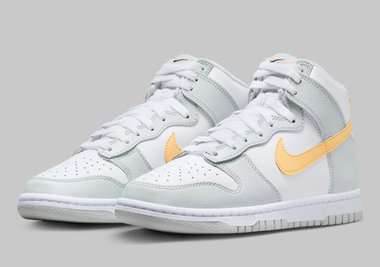 Yellow Swooshes Add A Pop Of Color To This Grey-Dressed Nike Dunk High