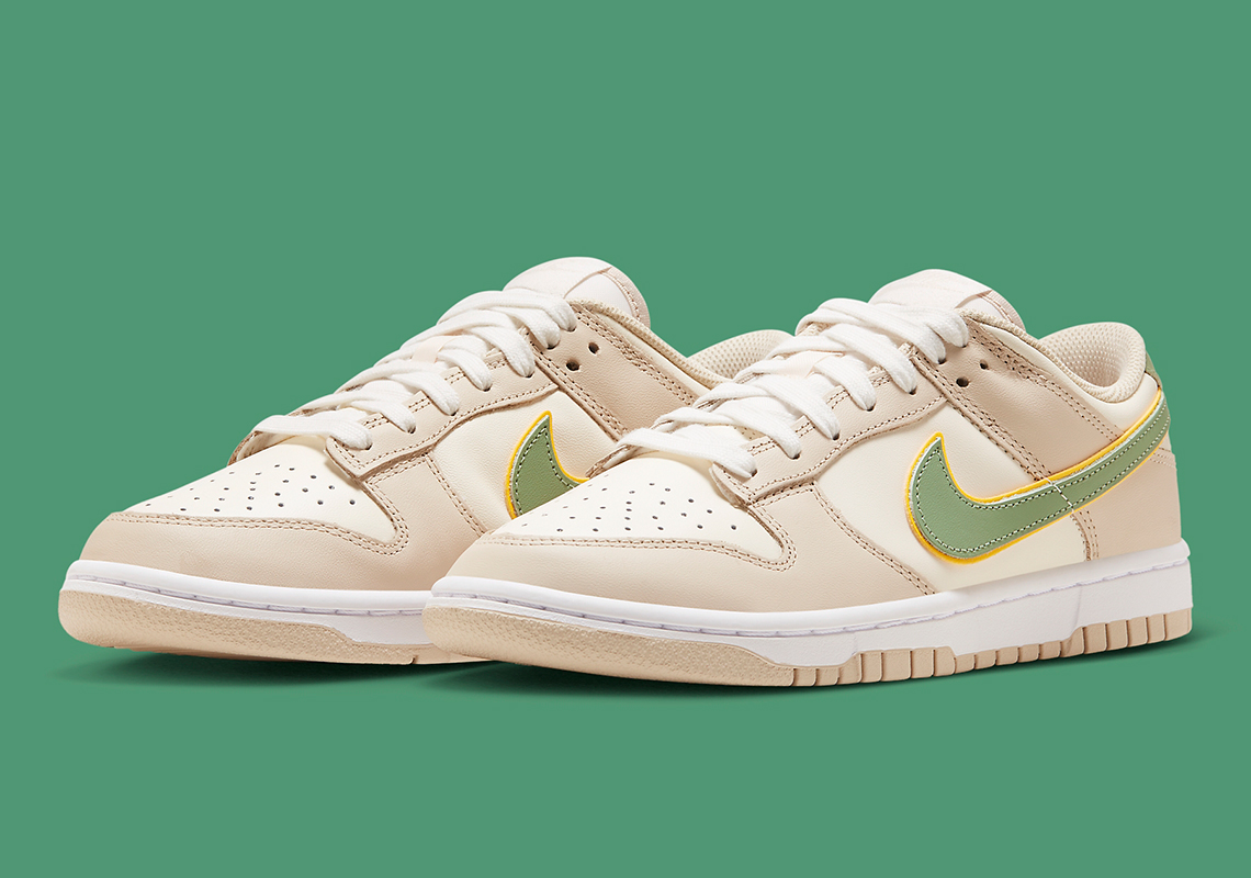 The Nike Dunk Low "Pale Ivory" Sees A Stacked Swoosh In Green
