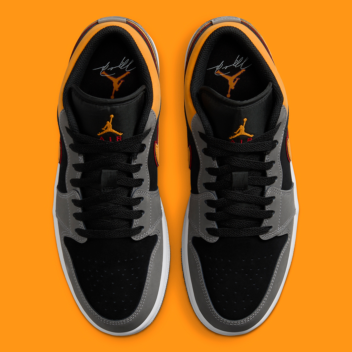 black and orange jordan 1 low