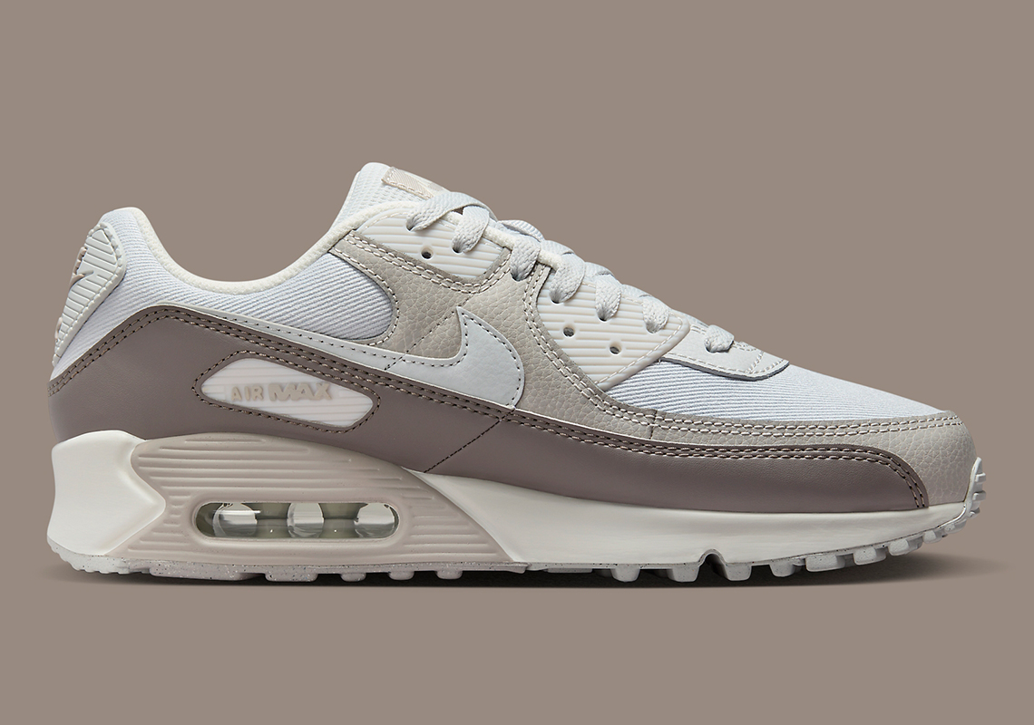 The Nike Air Max 90 combines "Photon Dust" with "Light Iron Ore" in