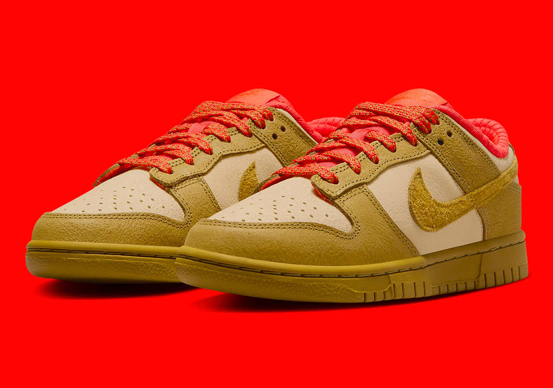 This Nike Dunk Low Pairs “Sesame” And “Bronzine” With A Dash Of “Picante Red” - Sneaker News