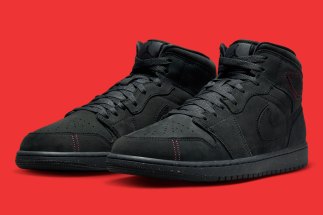The Air Jordan 1 Mid Prepares A Clad-Black Offering With Intricate Red Stitching