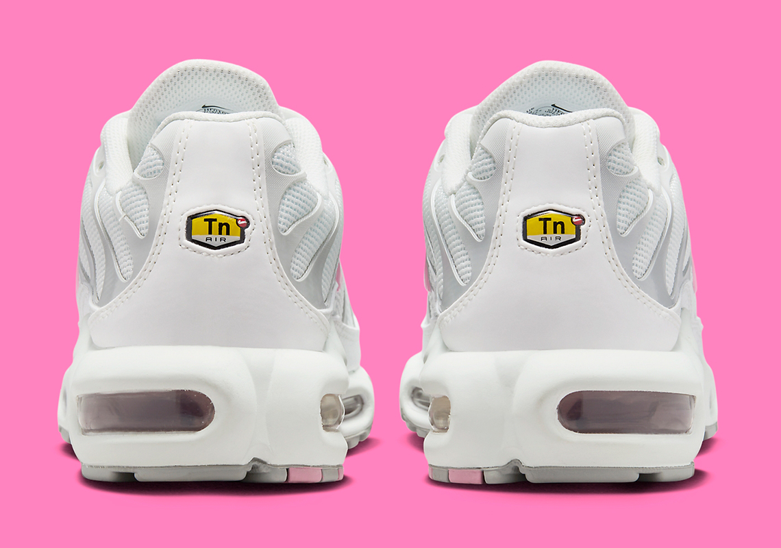 pink and white nike air max plus