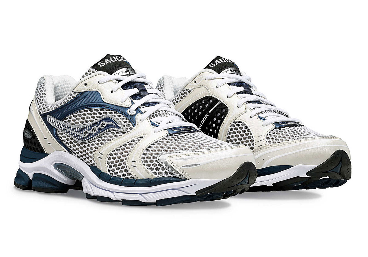 The Saucony ProGrid Triumph 4 Dresses In “White/Navy” For Spring