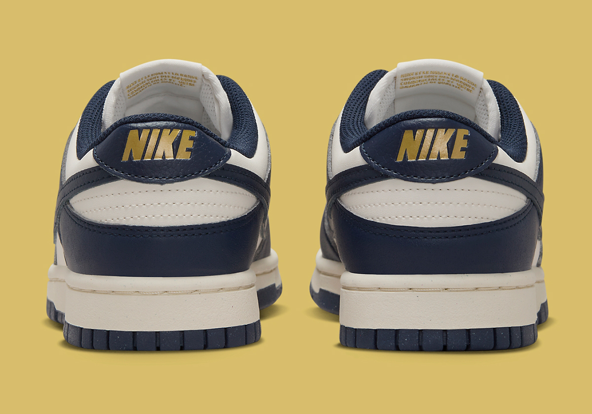 Nike Adds Vintage Touches To The Dunk patterns Low With Golden Accents