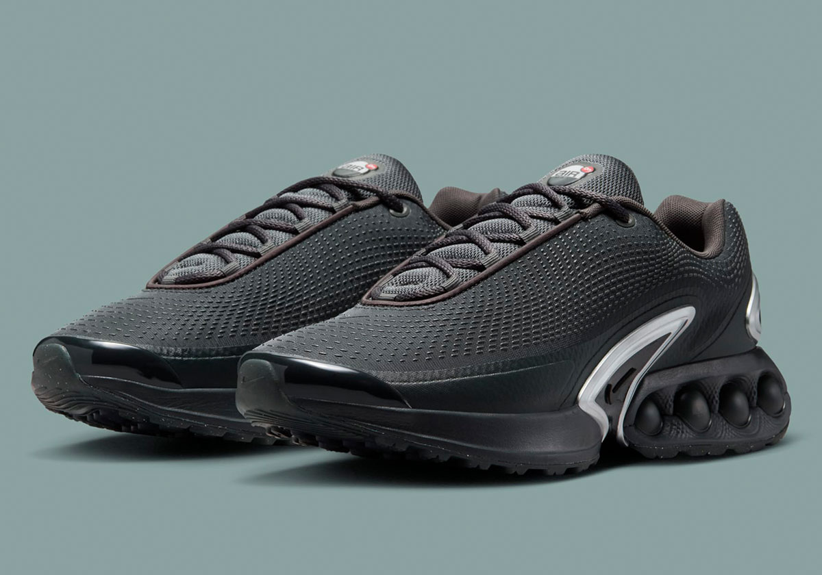 Metallic Silver Courses Through An All-Black Air Max Dn