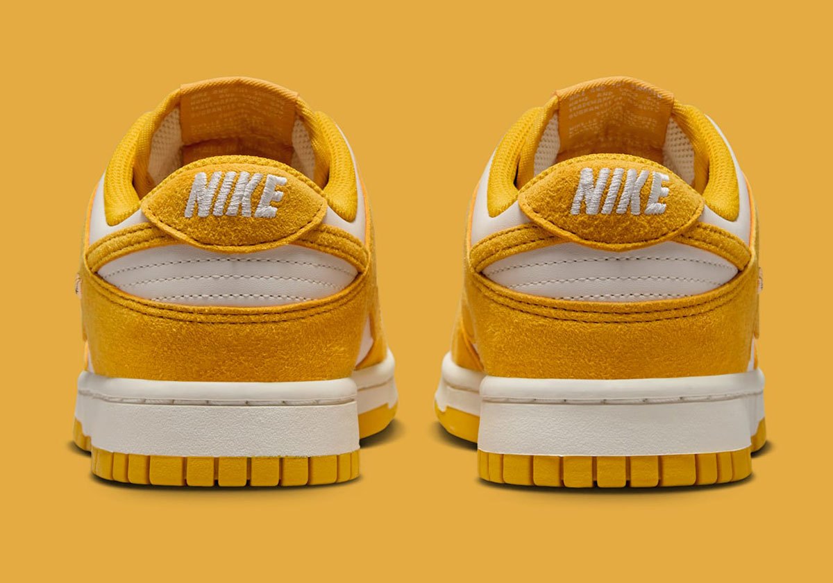 Dunks Mini Nike Dunk Low Gold Mini Swoosh IB4417-100 | SneakerNews.com