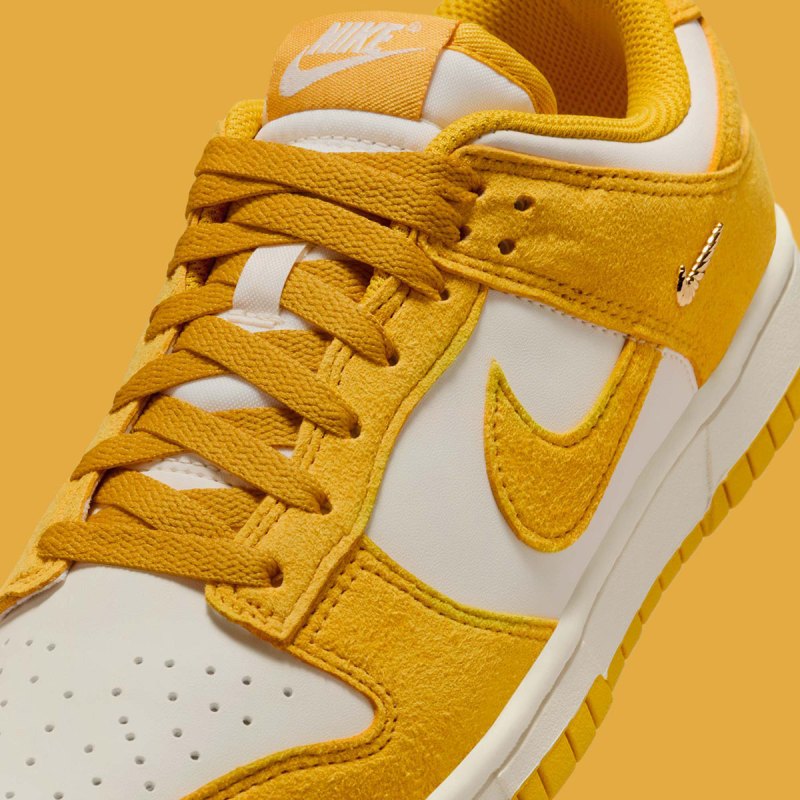 Dunks Mini Nike Dunk Low Gold Mini Swoosh IB4417-100 | SneakerNews.com
