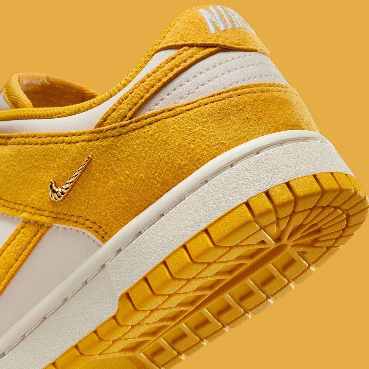 Dunks Mini Nike Dunk Low Gold Mini Swoosh IB4417-100 | SneakerNews.com